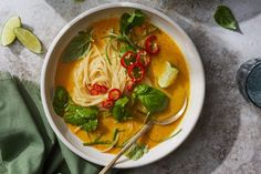 two bowls of soup with noodles and vegetables