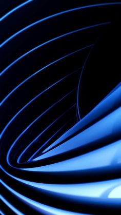 an abstract image of blue spirals in the dark