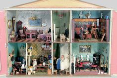 a doll house with all the furniture and accessories in it's pink display case