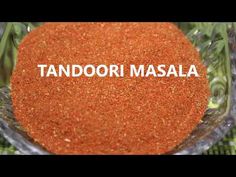 tandoori masala in a glass bowl with the word tandoori masala written on it