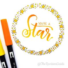 two pens sitting next to each other on top of a white paper with the words you're a star