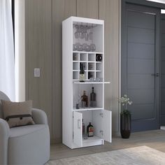 a living room filled with furniture and a tall white shelf next to a chair in front of a window