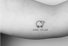 a black and white photo of a sheep tattoo