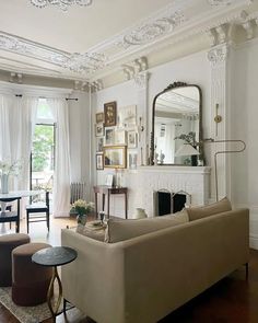 a living room filled with furniture and a fire place