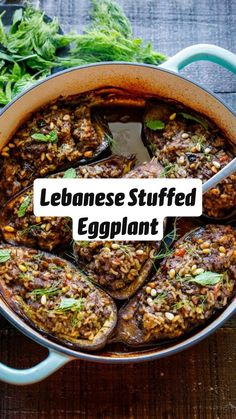 an eggplant dish in a blue pot with the words lebanese stuffed eggplant