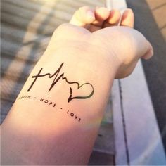 a person's arm with a heartbeat tattoo on it and the word hope written in cursive writing