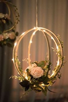 a flower arrangement hanging from a chandelier