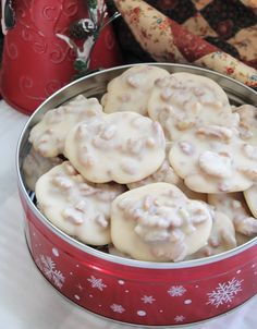 a tin filled with cookies sitting on top of a table