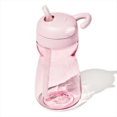 a pink sippy cup with a straw sticking out of it's top and lid