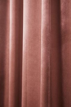 a close up view of a curtain with pink velvet on the top and bottom part