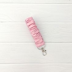 Whether you're planning a romantic date night or simply want to express your love for the holiday, this Light Pink Satin Scrunchie-style Keychain is just right! Perfect for gifting! Available as a set with a matching scrunchie hair tie.  When purchased as a set, enjoy a generous discount. Each scrunchie Wristlet Keychain is handmade by us just for you in our home studio. Made with care to ensure you receive a quality product that will last forever! Machine Sewn. Our photos are taken inside using daylight LED bulbs, or outside with natural lighting. Factors including lighting, computer/phone screen resolution, and image quality that make it impossible to represent colors with 100% accuracy. We do our best to represent the fabrics as closely as possible in our product photos. Sizing:  Each S Scrunchie Wristlet, Calendar Keychain, Picture Keychain, Scrunchie Styles, Leather Anniversary Gift, Hair Coils, Leather Anniversary, Teachers Day Gifts, Scrunchie Hair