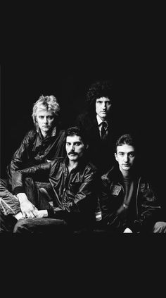 an old black and white photo of five men in leather jackets posing for the camera