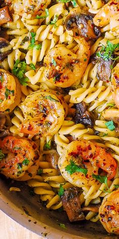 pasta with shrimp and mushrooms in a skillet