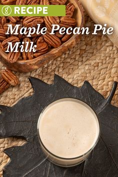 maple pecan pie milk in a glass next to an oak leaf