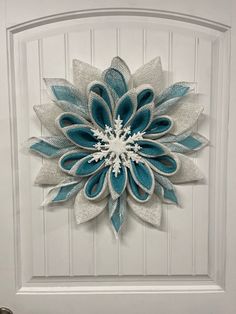 a white door with a blue flower on it