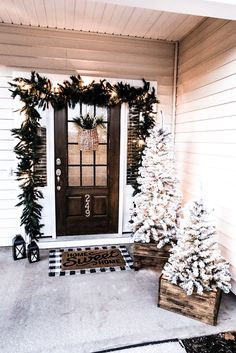 two christmas trees on the front porch