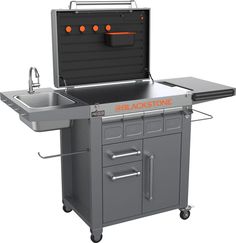 an outdoor kitchen with a sink and oven on it's side, in front of a white background