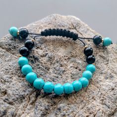 Natural blue turquoise and black onyx shambala bracelet. Gift for her. black nylon rope, gold spacers, everyday bracelet. balance Black Spiritual Friendship Bracelets With Sliding Knot, Bohemian Black Braided Bracelet With 8mm Beads, Black Bohemian Braided Bracelet With 8mm Beads, Mens Onyx Bracelet, Black Beads Bracelet, Shambala Bracelet, Mens Bracelet Fashion, Beading Bracelets, Turquoise And Black