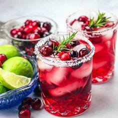 two glasses filled with cranberry lemonade and lime