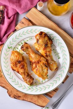 three pieces of chicken on a white plate