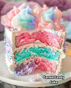 a close up of a slice of cake on a plate with the words cotton candy cake