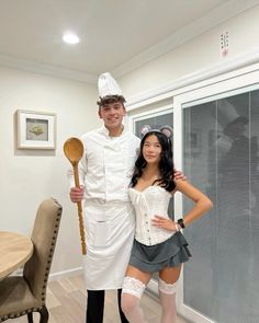 a man and woman dressed up as chefs