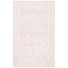 a pink and white rug with an intricate design on the bottom, in front of a white background