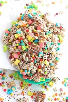 sprinkles and cereal are mixed together on a plate