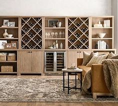 a living room filled with furniture and a wine rack