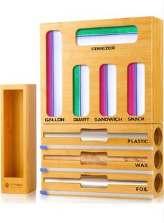 a wooden box with several different types of pencils in it and two boxes next to each other