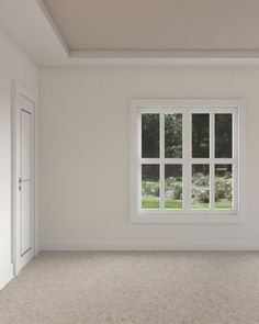 an empty room with white walls and windows