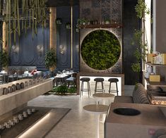 the interior of a restaurant with tables, chairs and plants hanging from the ceiling above