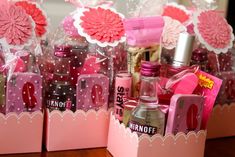 two pink boxes with various items in them