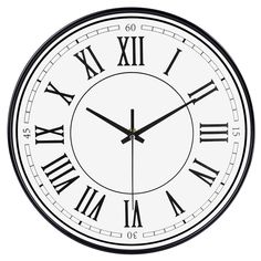 a black and white clock with roman numerals on it's face is shown