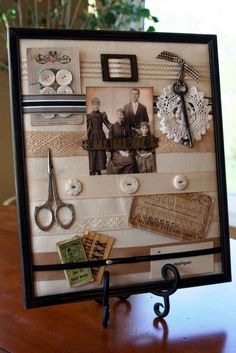 an old photo frame is decorated with buttons and other things