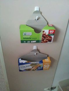 an open door with some food hanging from it's handle and two boxes attached to the door