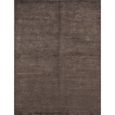 an area rug with dark brown colors