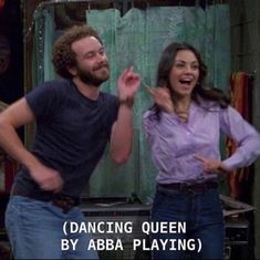 a man and woman standing next to each other in front of a mirror with the caption dancing queen by aba playing