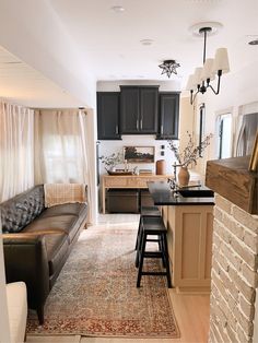 a living room and kitchen area in a home