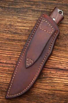 a brown leather sheath with stitching on it