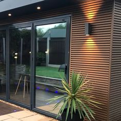 an outside patio with a potted plant next to it