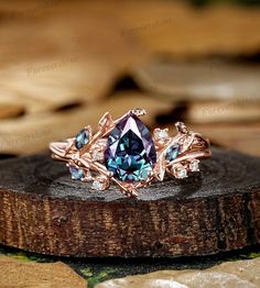 a blue ring sitting on top of a piece of wood