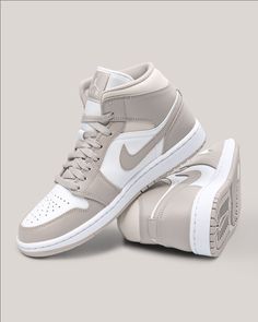 Looking for the perfect sneaker? This two-toned pair starts with a smooth white leather base that dominates the side panels and perforated toe box, while light grey leather overlays in the mudguard, eye stays and ankle collar dress the otherwise colorless upper. Tag us in your OOTD pictures with #styleyourpair! SKU:554724-082 Release Date: 24 Nov 2021 Color: College Grey/White/Light Bone #nike #linenwhite Classic White High-top Sneakers With Cushioned Footbed, Modern Gray Leather High-top Sneakers, White High-top Sneakers With Contrasting Heel Counter, Gray High-top Sneakers With Perforations And Round Toe, Mode Converse, Custom Air Jordan 1, Buty Marki Nike, Custom Air Jordan, Boty Nike