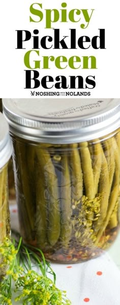 pickled green beans in a jar with text overlay that reads spicy pickled green beans