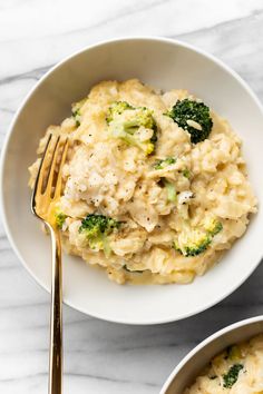 two bowls filled with mashed potatoes and broccoli