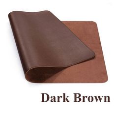 the dark brown leather cover is folded up on top of a white background with words underneath it