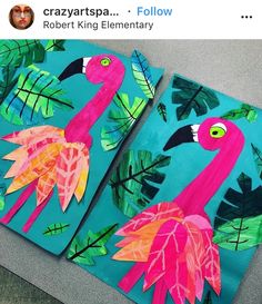 two pink flamingos painted on blue paper with green leaves and palm trees in the background