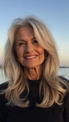 Layer It Up! 15 Unique Hair Ideas for Women Over 50 - Inspire Inlet Farah Fawcett Hairstyle Modern, Medium Length Hair Styles For Seniors, Medium Length Long Bangs, Hairstyles For Long Hair Older Women, Hair For Seniors Older Women, Blond Over 50, Long Heavy Hair Hairstyles, Short Hair On Older Women, Long Blonde Hair Over 50