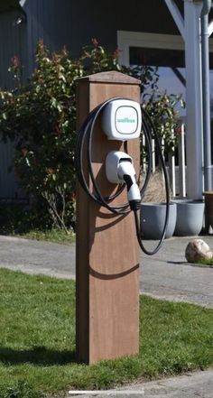 an electric car charger in front of a house