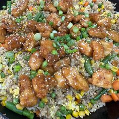 chicken and vegetable stir fry with rice in a skillet